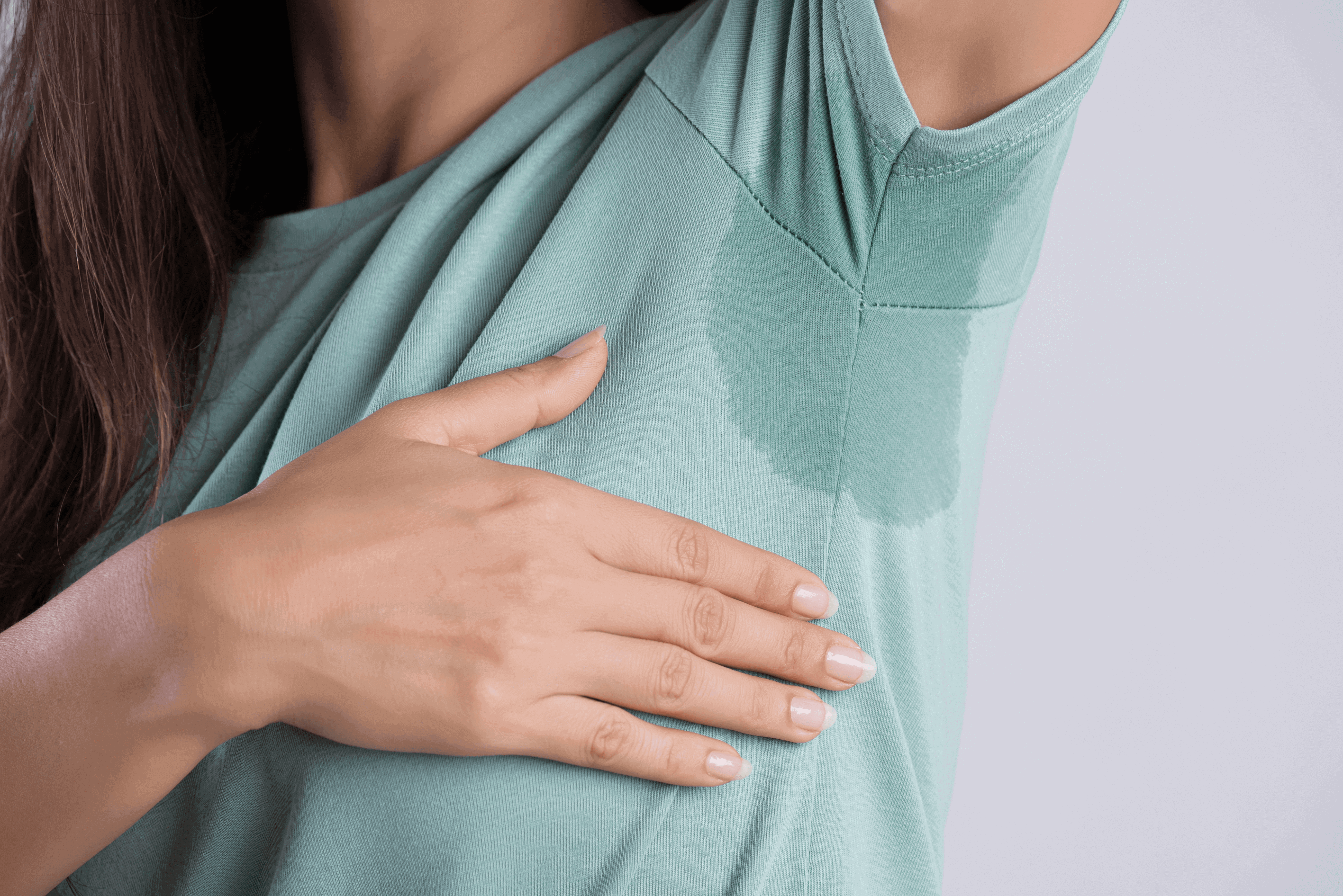 Person with sweat stain on shirt.